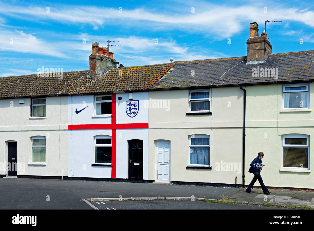 Terraced house in Fleetwood, Lancashire, painted to resemble the flag of St George, in support of the England football team, UK Stock Photo