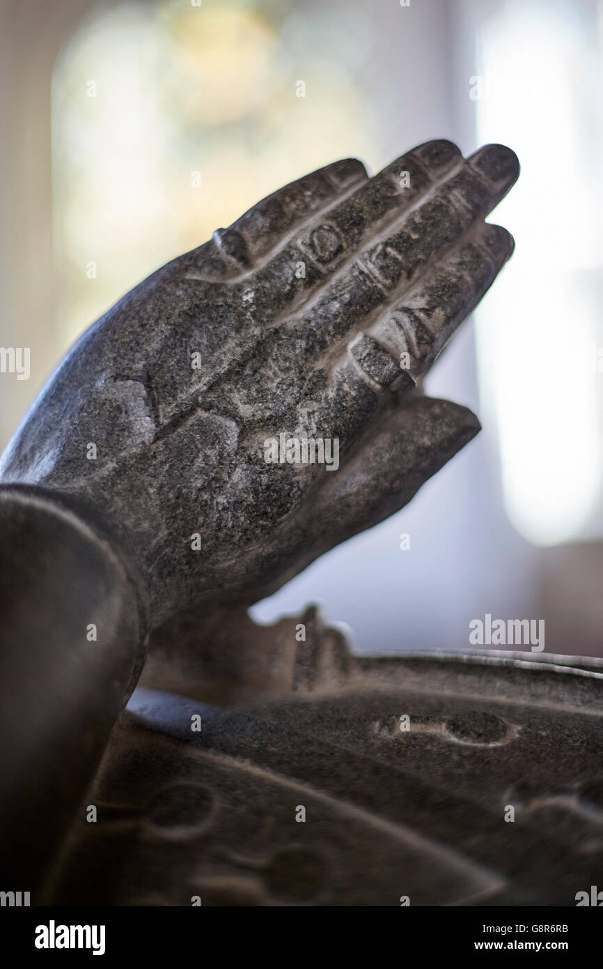 preying hands on statue on memorial grave Stock Photo