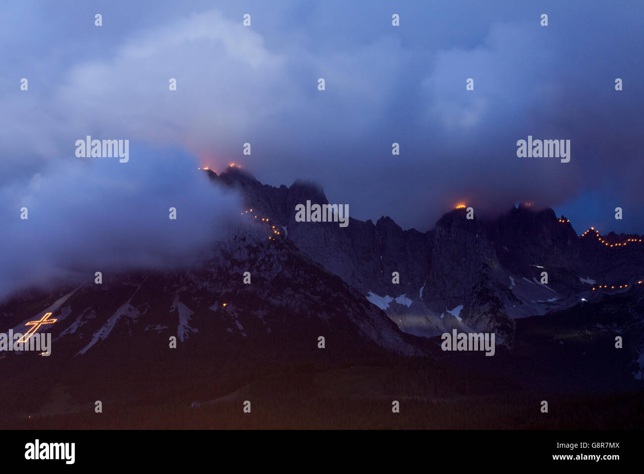 Summer Solstice lights and fires on the Wilder Kaiser mountains in the Austrian Tirol, seen at night from Ellmau, Austria Stock Photo
