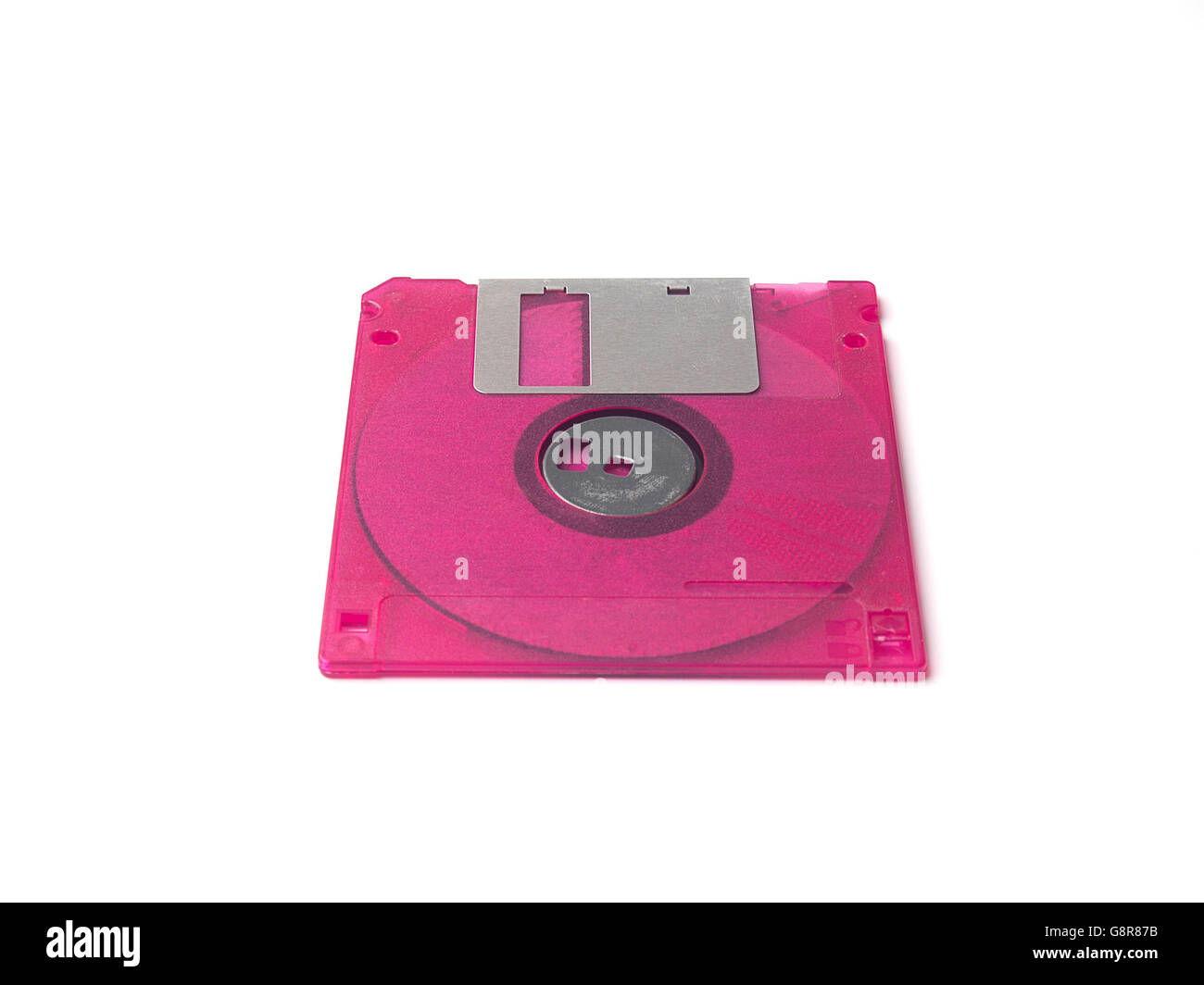 Fuchsia pink floppy disk or diskette isolated on white background ...