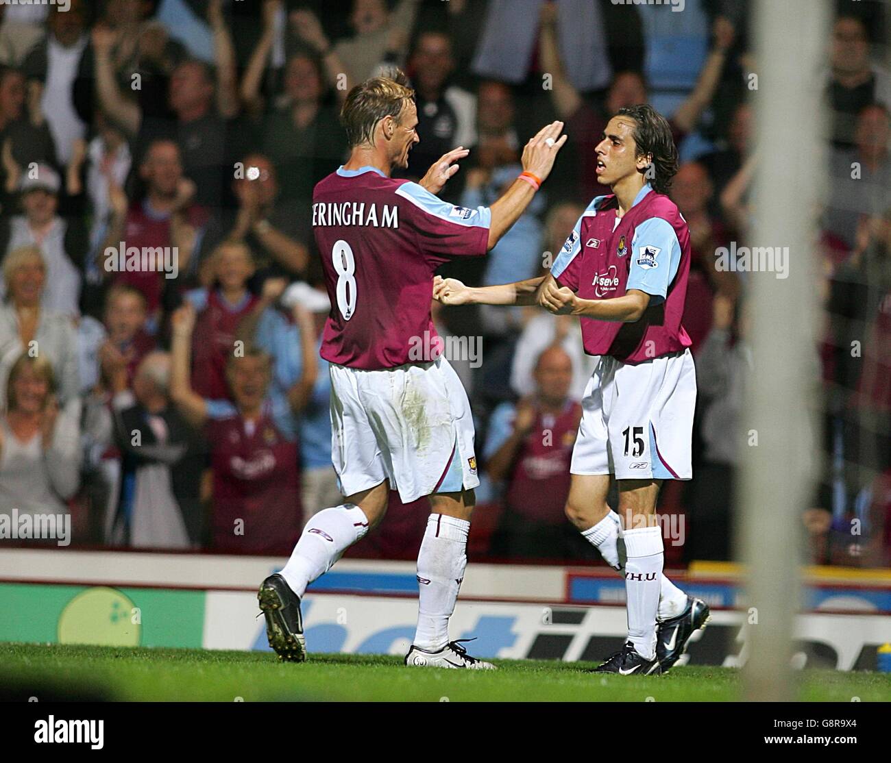 Soccer - FA Barclays Premiership - West Ham United v Aston Villa - Upton Park. West Ham United's Teddy Sheringham congratulates Yossi Benayoun on his goal Stock Photo