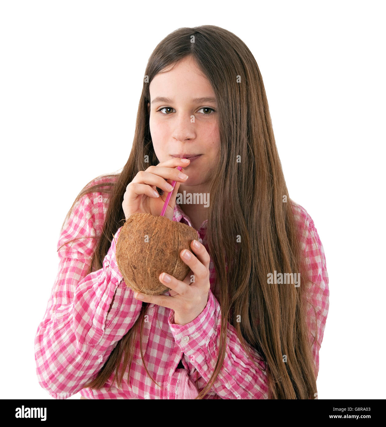 young girl drinking from a coconut Stock Photo