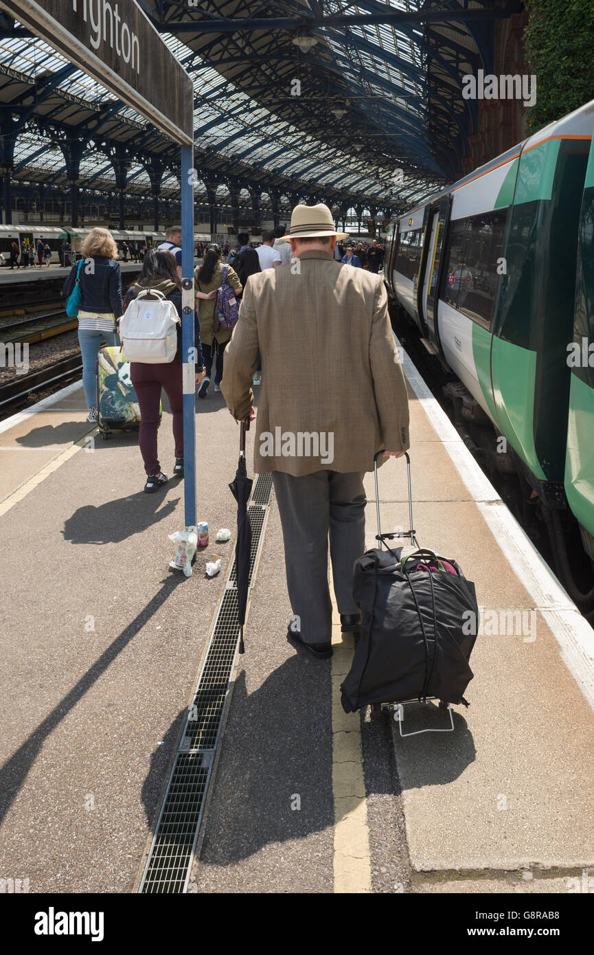 Old man and wheelie bag hi-res stock photography and images - Alamy
