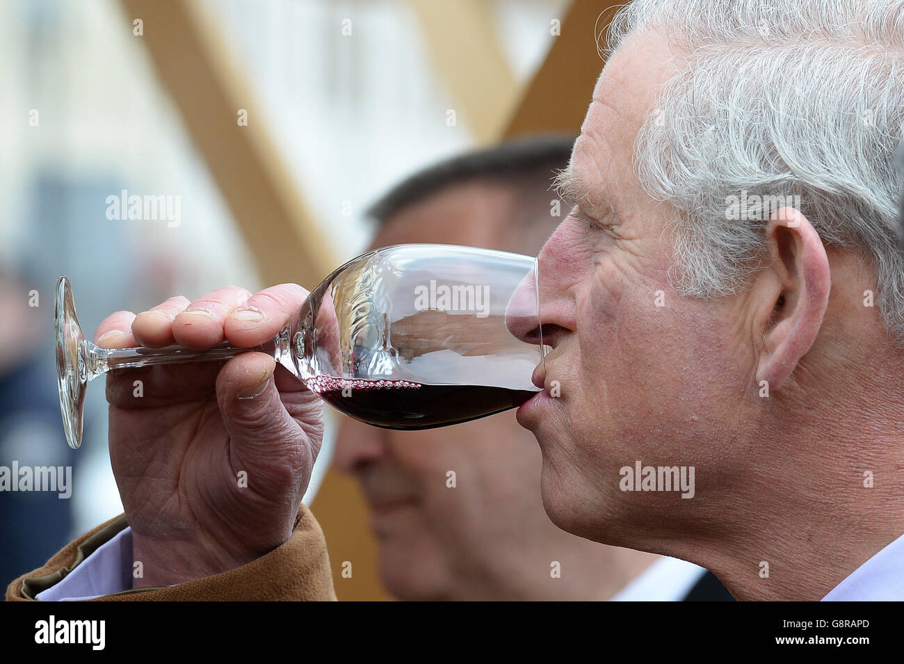 The Prince of Wales samples a local wine as he tours craft stalls in Tvrda, the old town of the city of Osijek in eastern Croatia, with the Duchess of Cornwall on the second day of their tour of the Balkans. Stock Photo