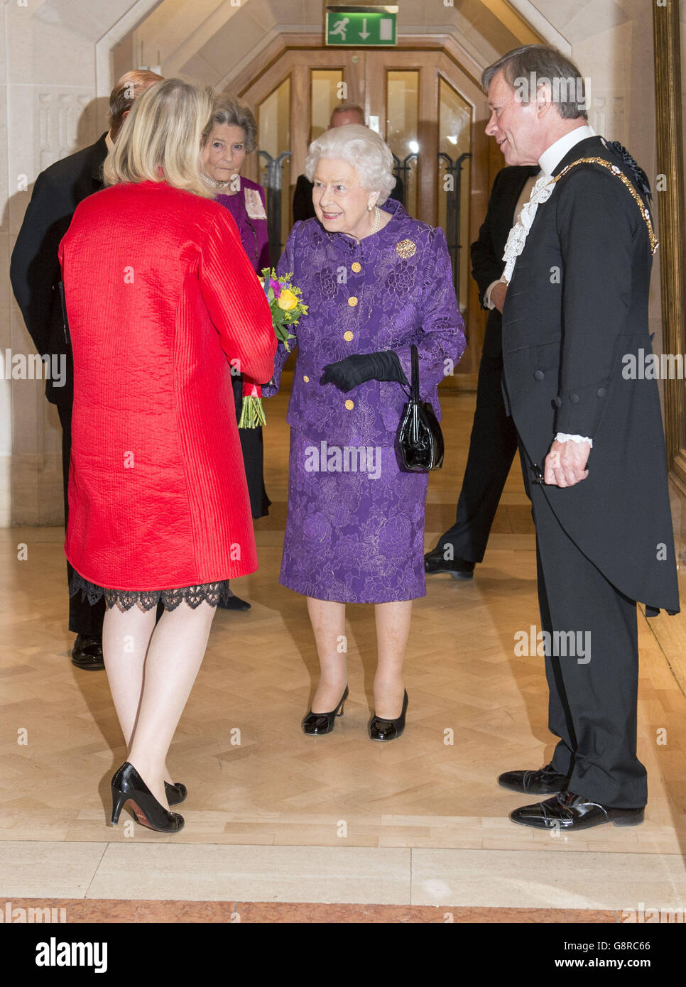 Lord Mayor of the City of London Jeffrey Mountevans (right) as Queen Elizabeth II is presented with flowers by his wife Juliet Mountevans at a reception to mark Commonwealth week at the Guildhall in London. Stock Photo