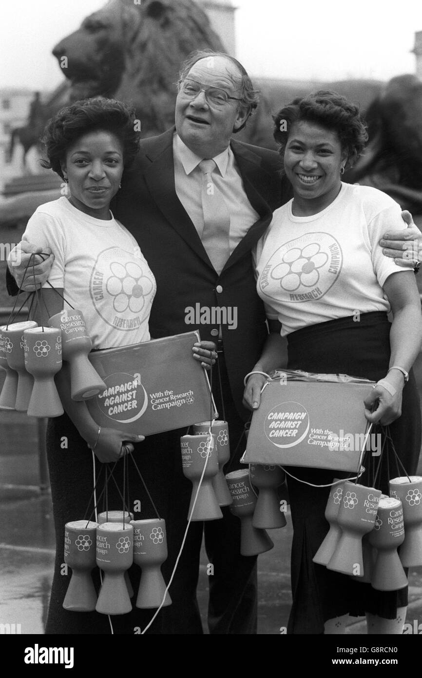 Television presenter Cliff Michelmore alongside collection volunteers Angela Thomas (l) 22, and Hazel Lecointe, 24, in London at the launch of the Cancer Research Campaign's 'Flag Day' in London on June 11th. Cliff, who has lost family through the disease, is personally backing this year's 'flag day'. Stock Photo