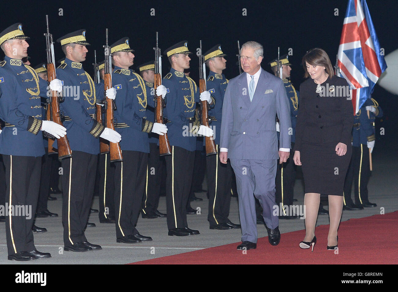 The Prince of Wales arrives at Adem Jashari Airport in Pristina, Kosovo and walks past a guard of honour with the President of Kosovo, Atifete Jahjaga, on the fifth day of his and the Duchess of Cornwall's four country six day tour to the Balkans. Stock Photo