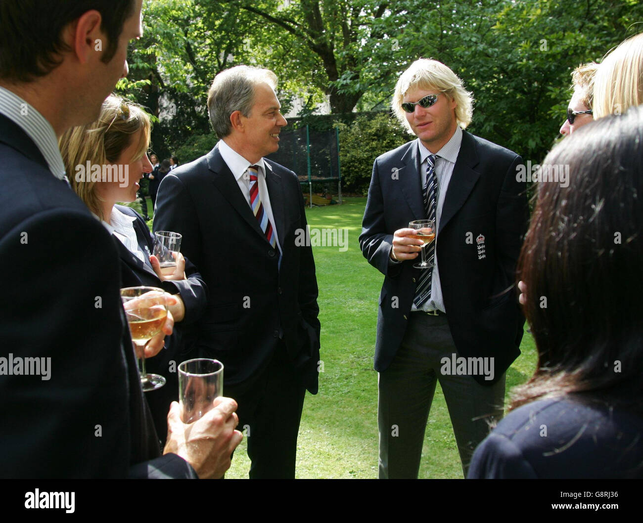 Britain's Prime Minister Tony Blair (L) talks to England cricketer Matthew Hoggard during a reception at Downing Street in central London, Tuesday 13 September 2005 in honour of the England cricket team who beat Australia in a five-match series to regain the Ashes. Tens of thousands of England cricket fans lined the streets of London on today to congratulate their team after England's first Ashes triumph over Australia for almost two decades. See PA Story SPORT Ashes. PRESS ASSOCIATION Photo. Photo credit should read: Mike Finn-Kelcey/PA/WPA Pool/Reuters Stock Photo
