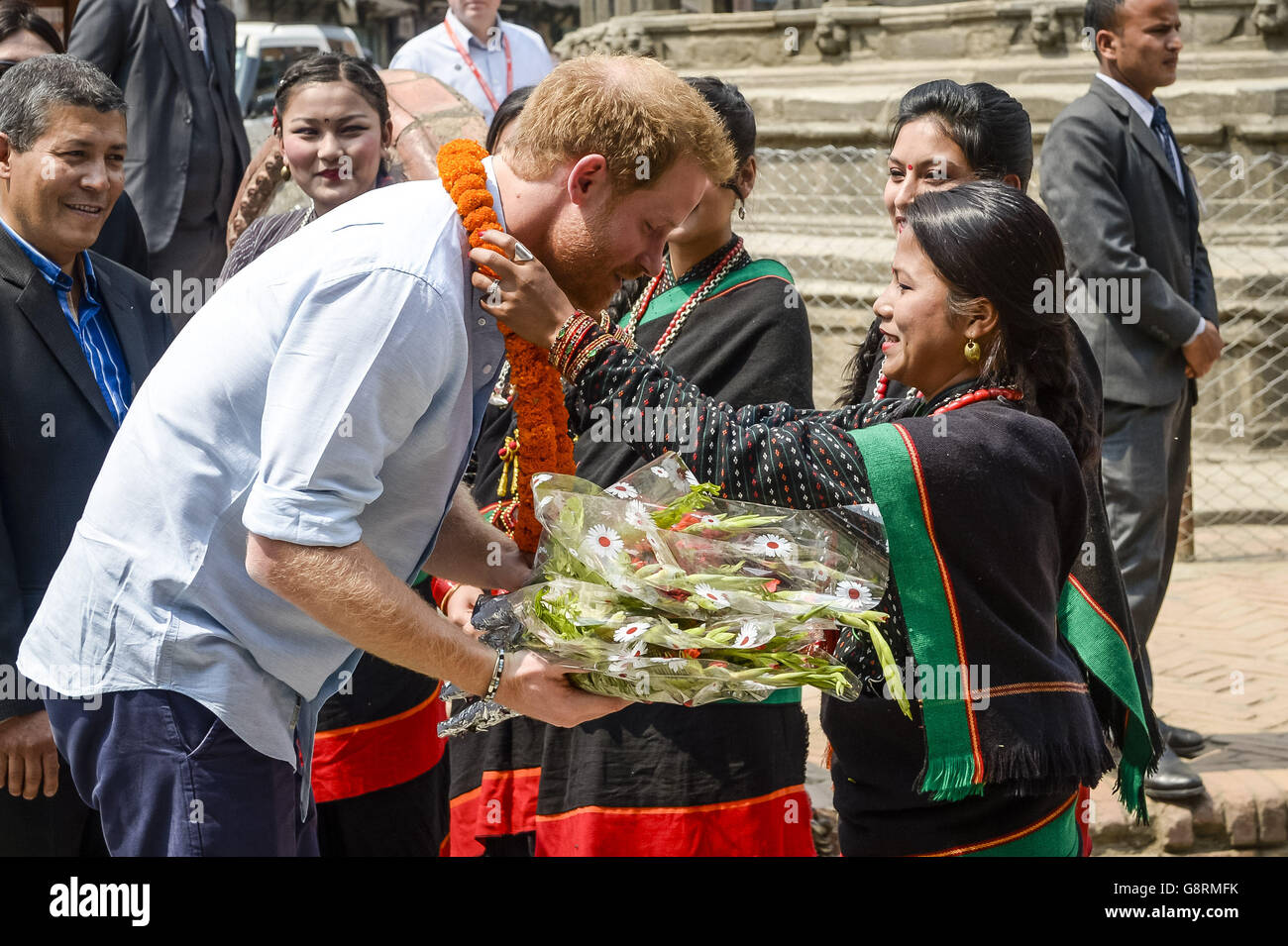 Prince Harry receives a garland from Mayia Maharaja as he arrives at Patan Durbar Square to visit Kathmandu's historic UNESCO World Heritage Site, which was damaged in the 2015 earthquake, during the second day of his tour of Nepal. Stock Photo