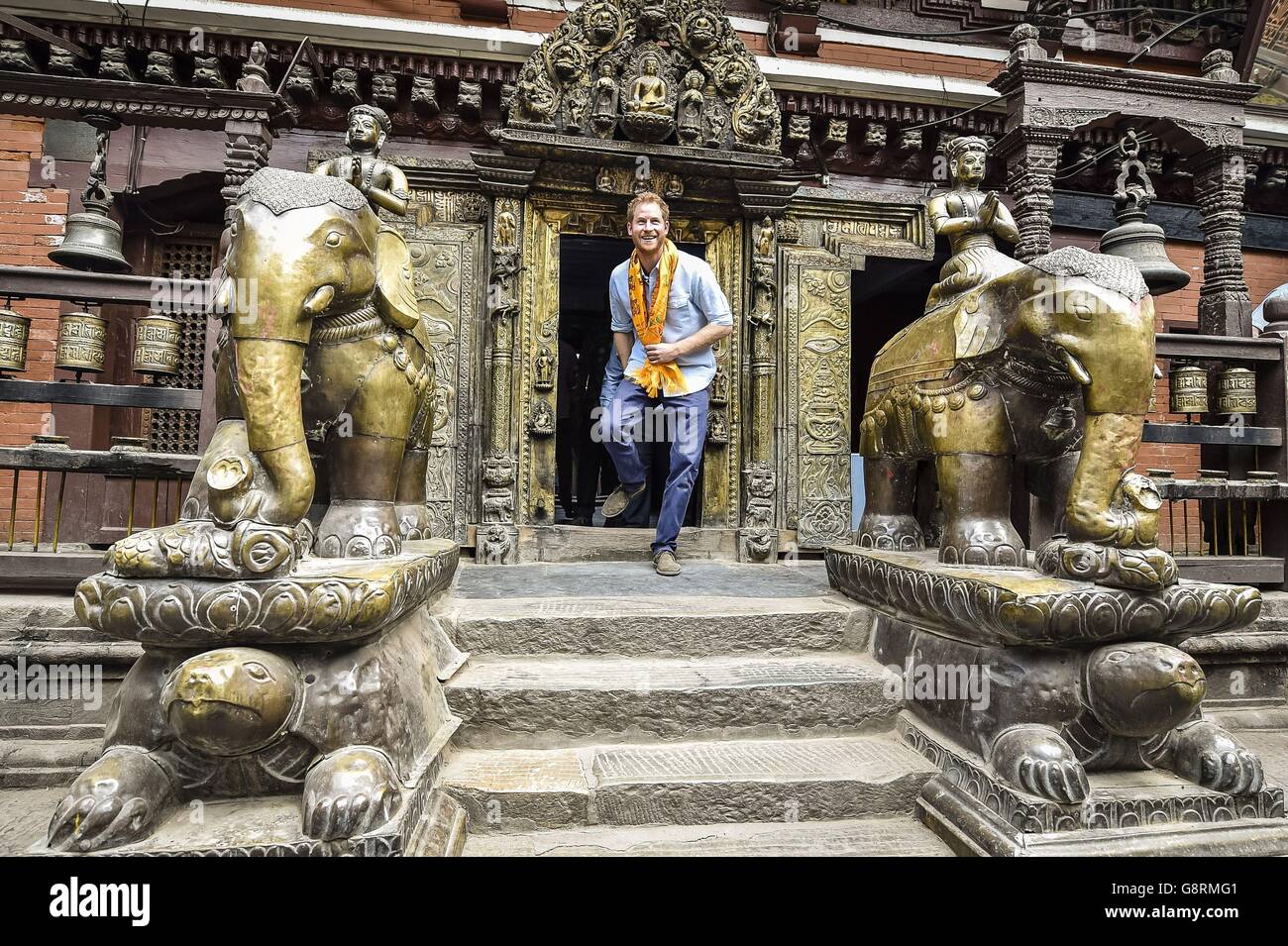 Prince Harry enters Hiranya Varna Mahavihar, know locally as the Golden Temple, in Kathmandu, during the second day of his tour of Nepal. Stock Photo