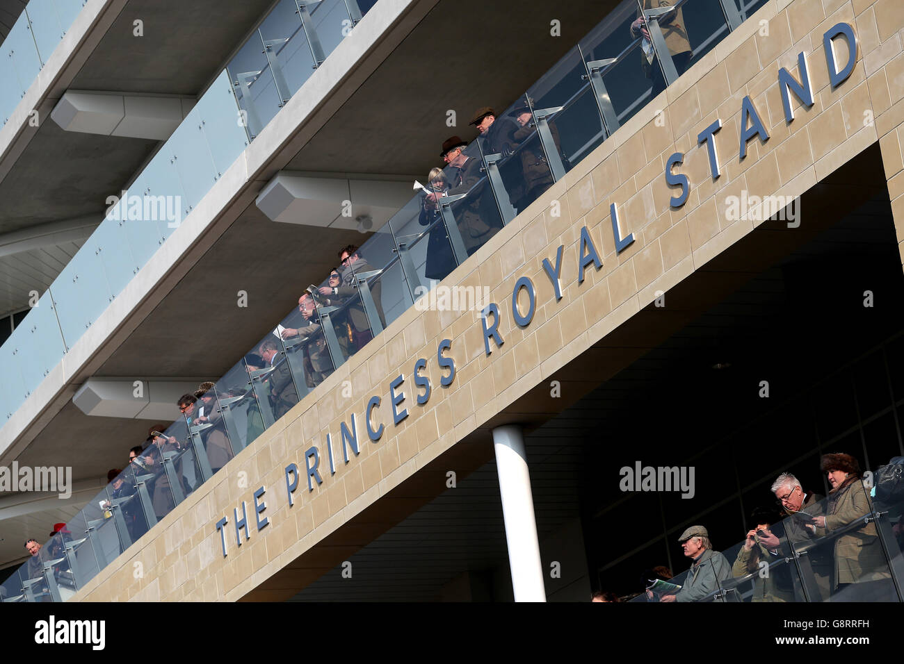 Racegoers look over the balcony of The Princess Royal Stand during St Patrick's Thursday of the 2016 Cheltenham Festival at Cheltenham Racecourse. PRESS ASSOCIATION Photo. Picture date: Thursday March 17, 2016. See PA story RACING Cheltenham. Photo credit should read: David Davies/PA Wire. Stock Photo