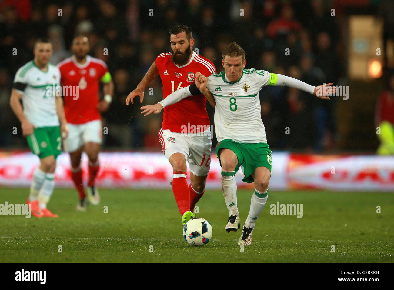 Wales Joe Ledley (left) and Northern Ireland's Steven Davis battle for the ball during the International Friendly at the Cardiff City Stadium, Cardiff. Stock Photo