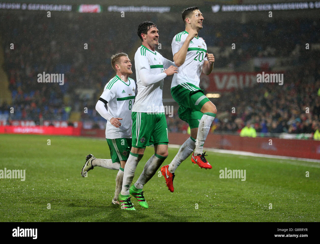 Northern Ireland's Craig Cathcart (right) celebrates scoring his side's first goal of the game during the International Friendly at the Cardiff City Stadium, Cardiff. Stock Photo