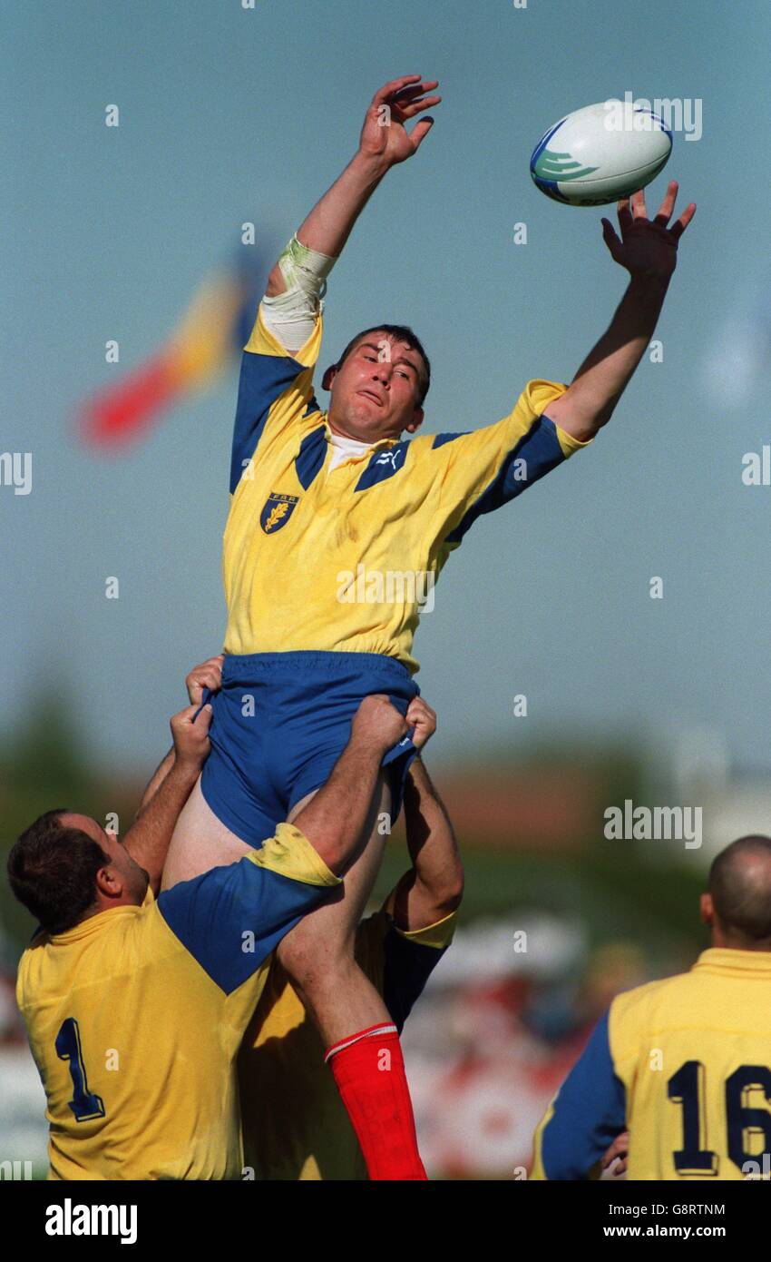 Romania's Titeriu Brinza wins the ball at a line-out with the help of his teammates Stock Photo
