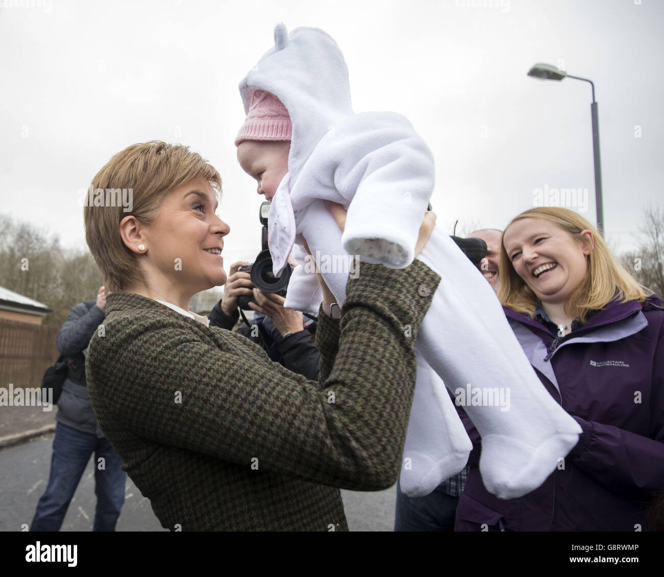 First Minister Nicola Sturgeon holds three-month-old Emily Kidd during ...