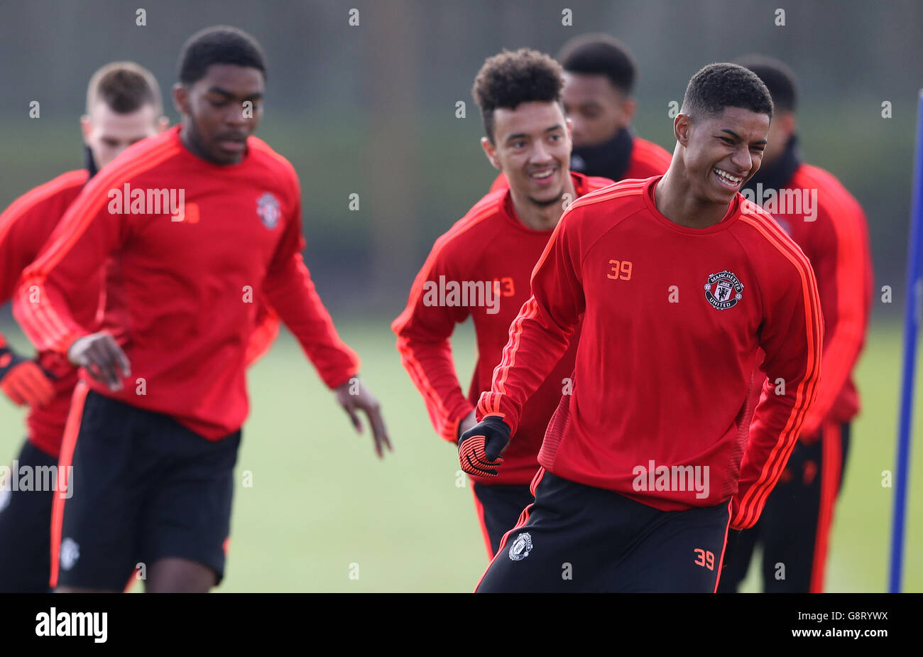 Manchester United's Marcus Rashford (right) Cameron Borthwick-Jackson (centre) and Timothy Fosu-Mensah (left) during a training session at the AON Training Complex, Carrington. PRESS ASSOCIATION Photo. Picture date: Wednesday March 16, 2016. See PA story SOCCER Man Utd. Photo credit should read: Martin Rickett/PA Wire.,during a training session at the AON Training Complex, Carrington. PRESS ASSOCIATION Photo. Picture date: Wednesday March 16, 2016. See PA story SOCCER Man Utd. Photo credit should read: Martin Rickett/PA Wire. Stock Photo