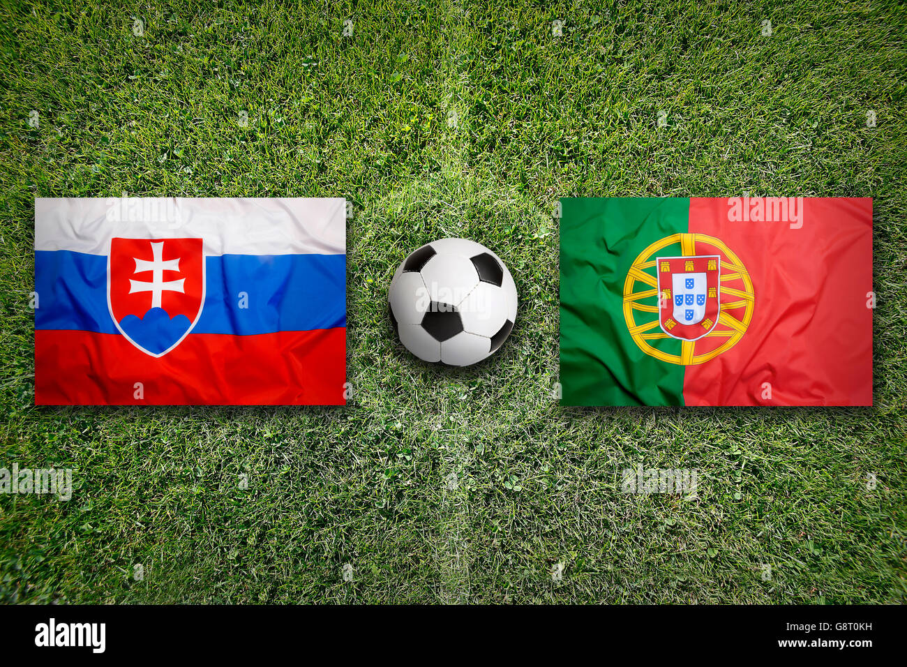 Slovakia vs. Portugal flags on green soccer field Stock Photo Alamy