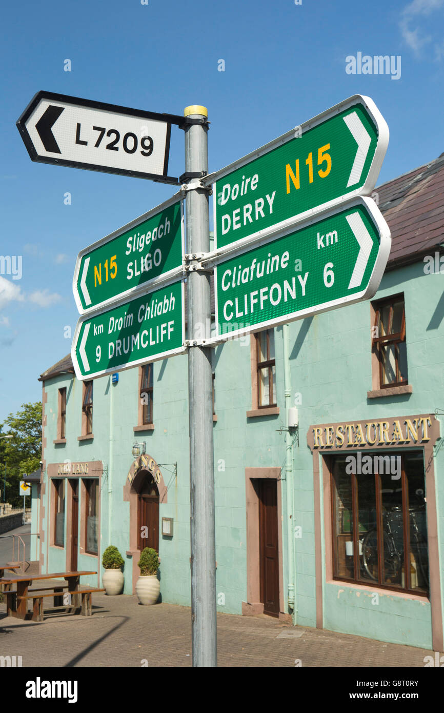 Ireland, Co Sligo, Grange, road signs outside John Lang’s lounge bar