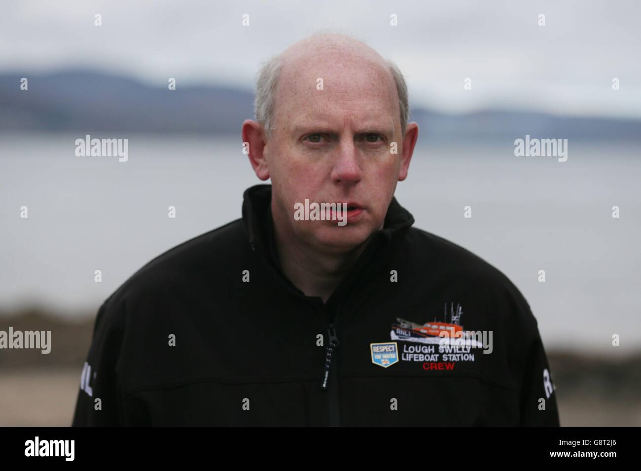 Joe Joyce from Lough Swilly Lifeboat crew at the scene at Buncrana Pier in Co Donegal after five people, including at least two children, have been killed and a baby girl is in hospital after a car they were in slipped from the pier. Stock Photo