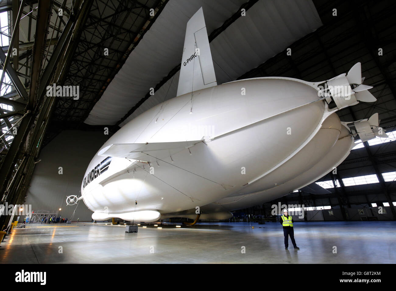The Airlander 10 airship, the world's largest aircraft, is unveiled for the first time since being fully assembled at Cardington hanger in Bedfordshire. Stock Photo