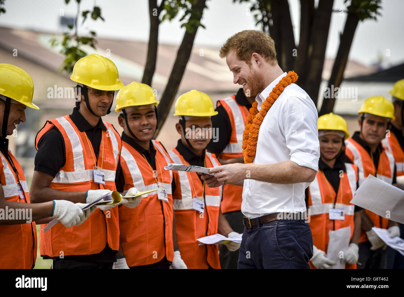 Prince Harry greets students and reads an instruction leaflet, printed in English, at the Samo Thimi Technical School, Bhaktapur, Nepal, which provides technical skills to underprivileged young Nepalese. Stock Photo