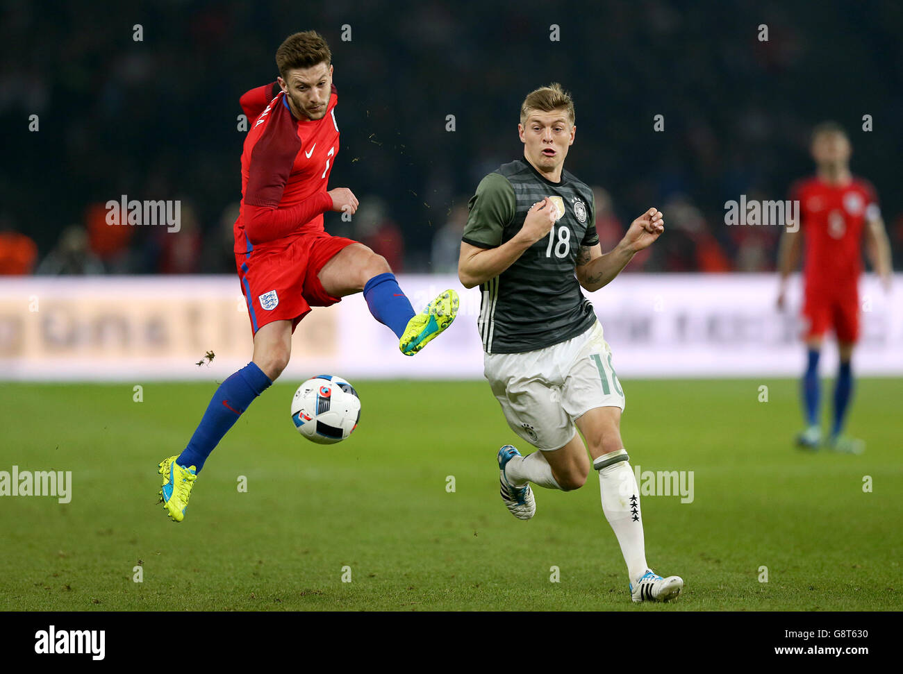 England's Adam Lallana and Germany's Toni Kroos (right) in action during the International Friendly match at the Olympic Stadium, Berlin. Stock Photo