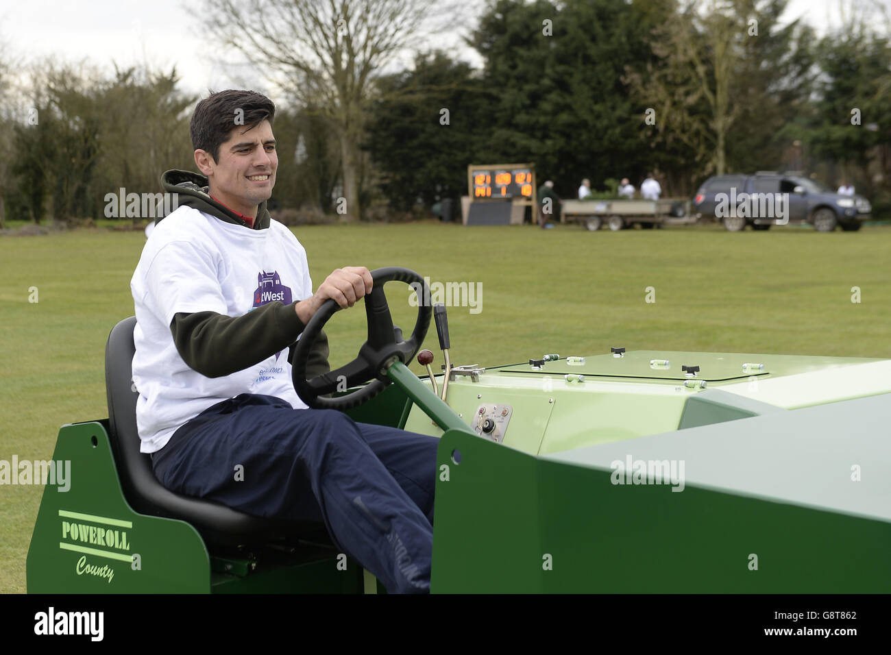 England captain Alastair Cook helps to roll the wicket during a photocall at Dymock Cricket Club in Gloucestershire. Stock Photo