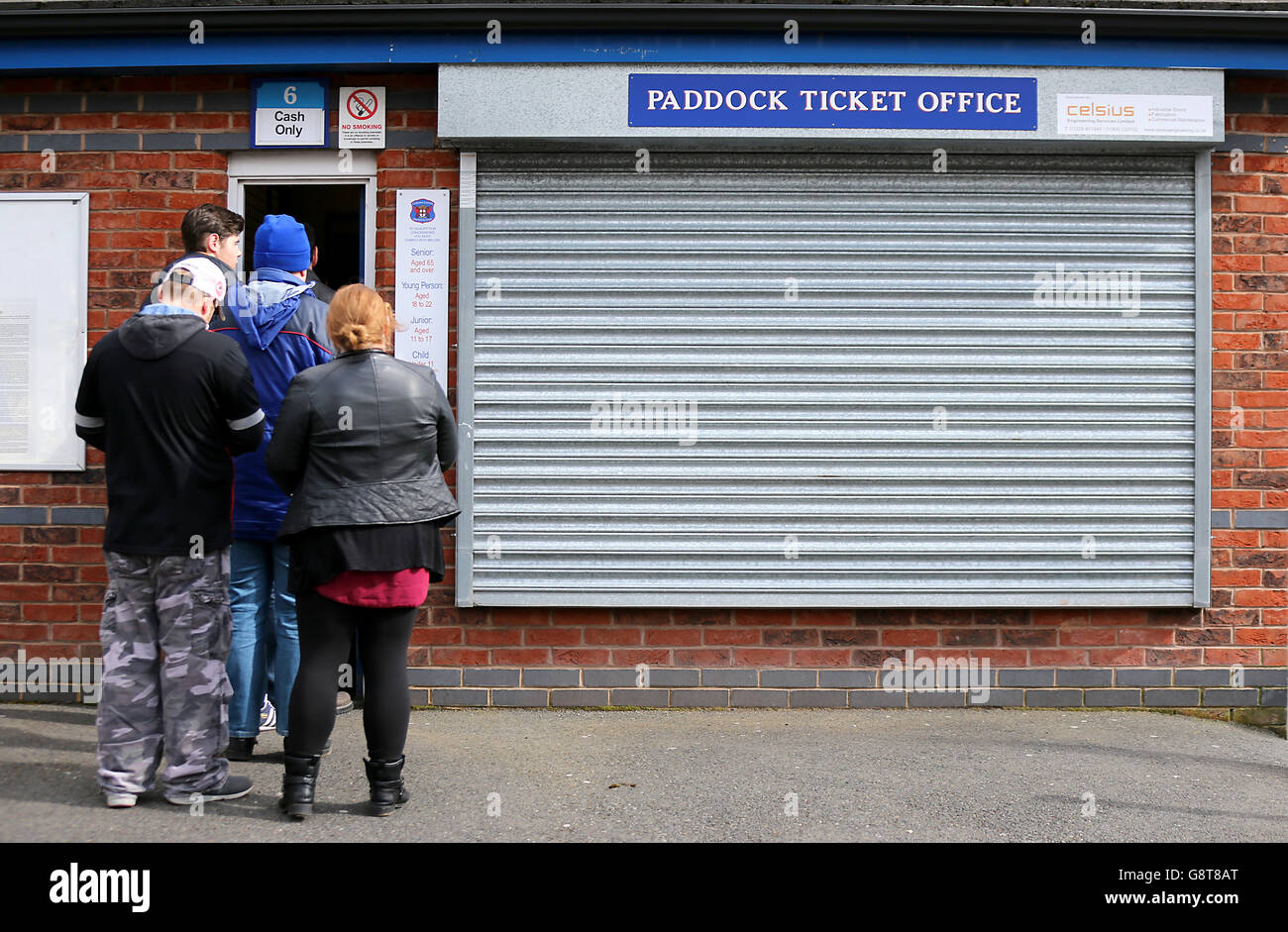 Fans queue up at the Paddock Ticket Office at Brunton Park Stock Photo ...
