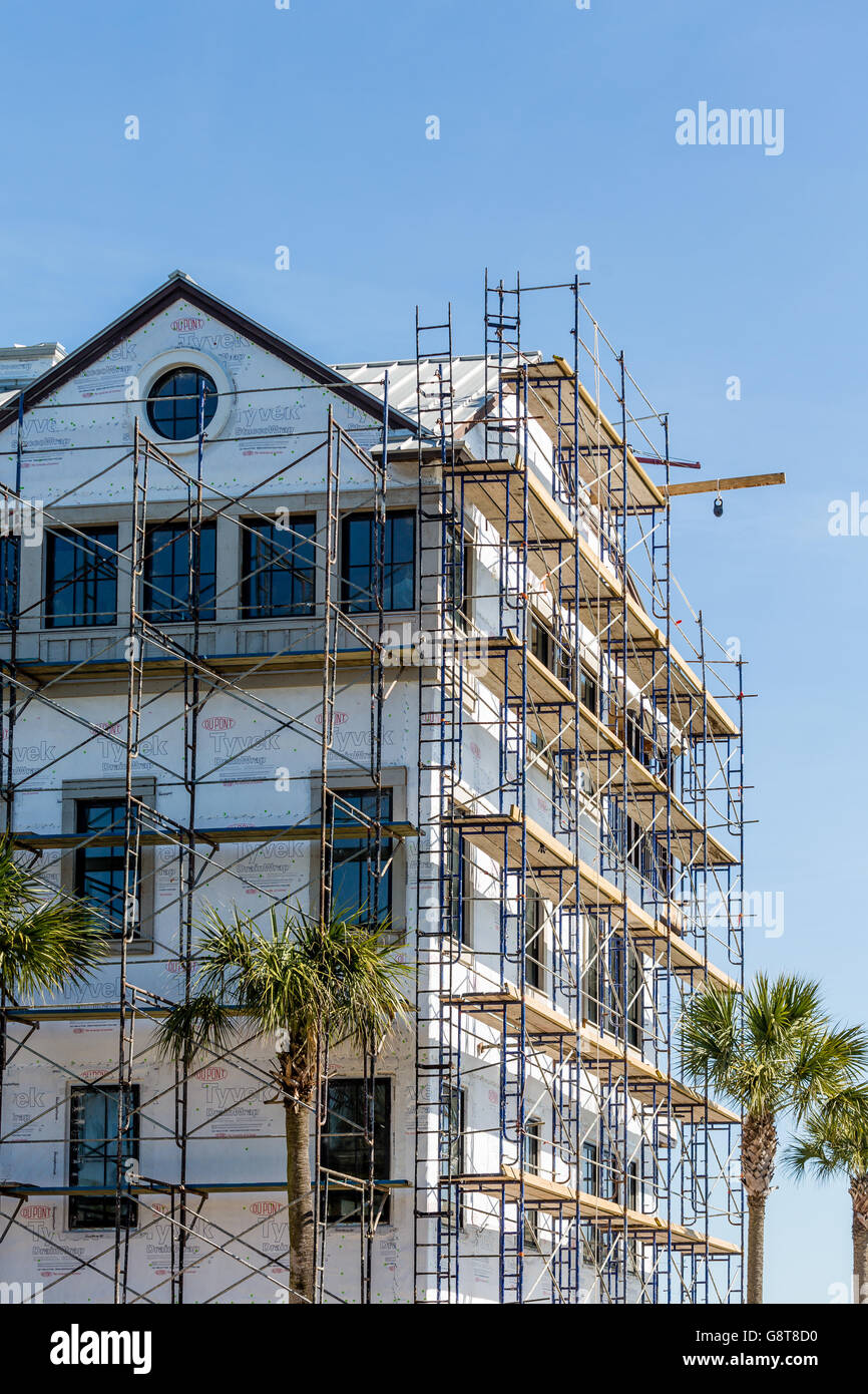 Large coastal home being built on St Simons Island wrapped in Tyvek sheathing and scaffolding Stock Photo