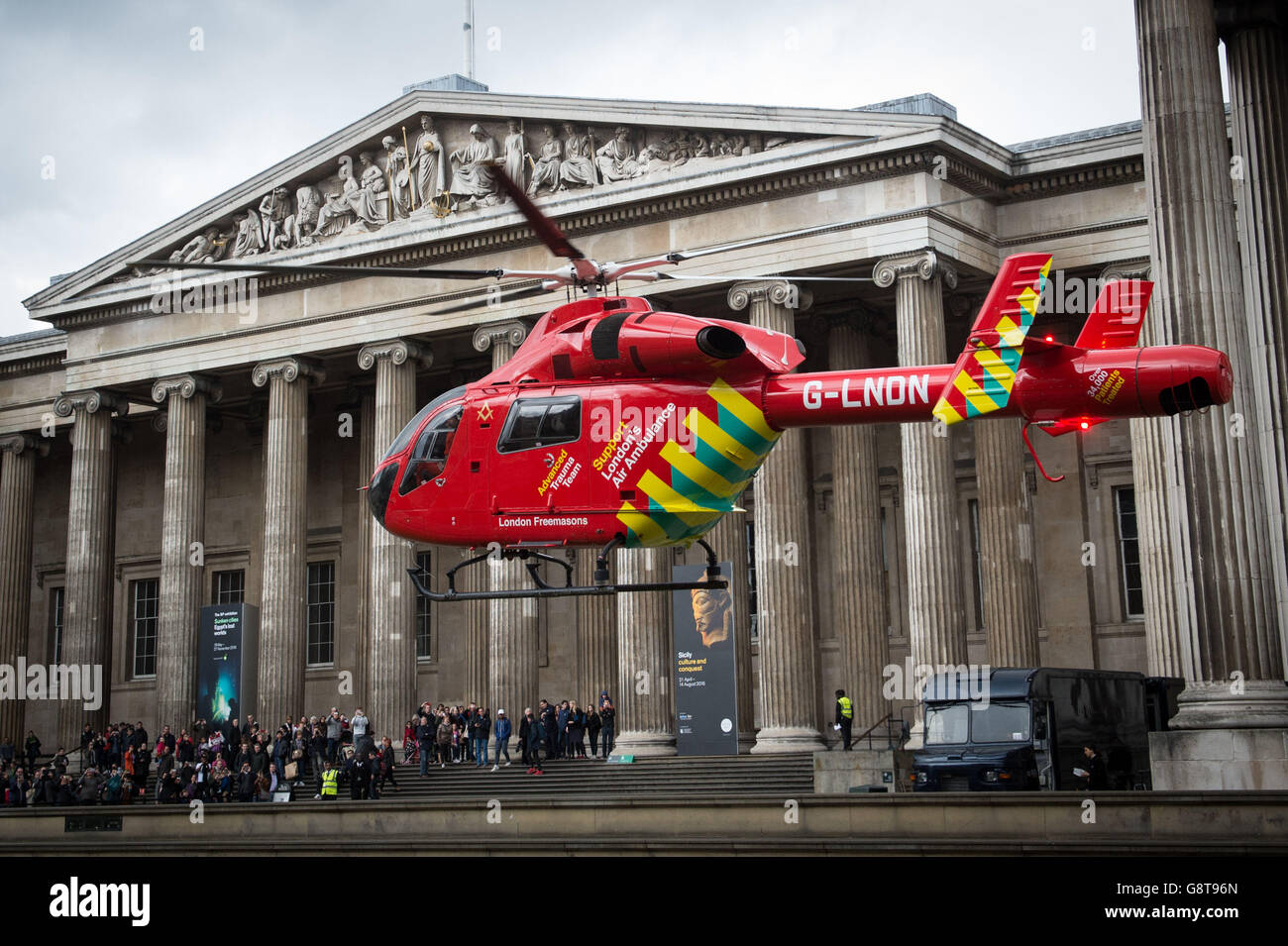 London's Air Ambulance takes off from the forecourt of The British Museum in central London after attending an incident. Stock Photo