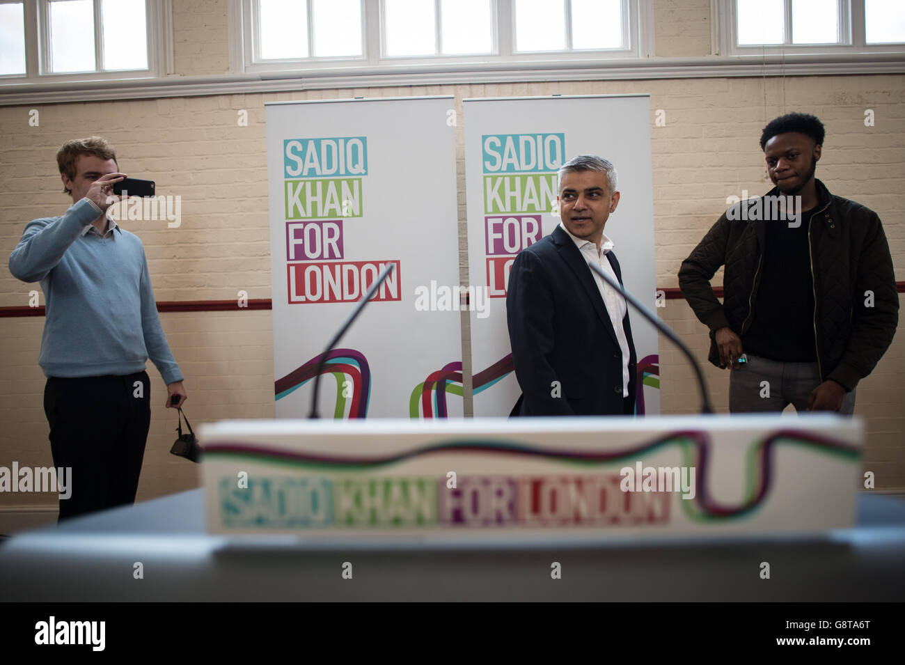 Sadiq Khan (centre), Labour's candidate for Mayor of London, makes a speech laying out his plans for affordable housing in the capital, at the Anchor Community Centre in south west London. Stock Photo