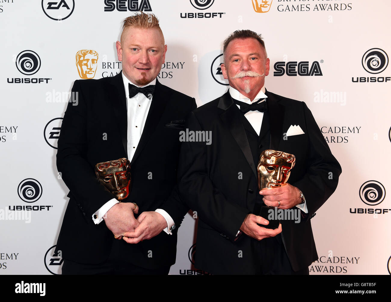 Winners of the Original Property Award for Until Dawn, John Rostron (left) and Will Byles at the British Academy Games Awards 2016, London. PRESS ASSOCIATION Photo. Picture date: Thursday April 7, 2016. See PA story SHOWBIZ Games. Photo credit should read: Matt Crossick/PA Wire Stock Photo