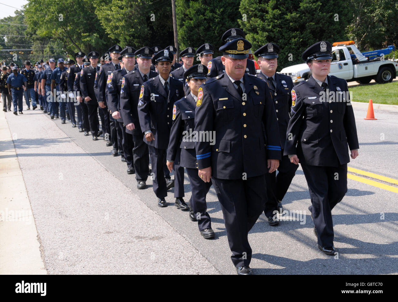Fairfax County Virginia Police march down the street to take a position