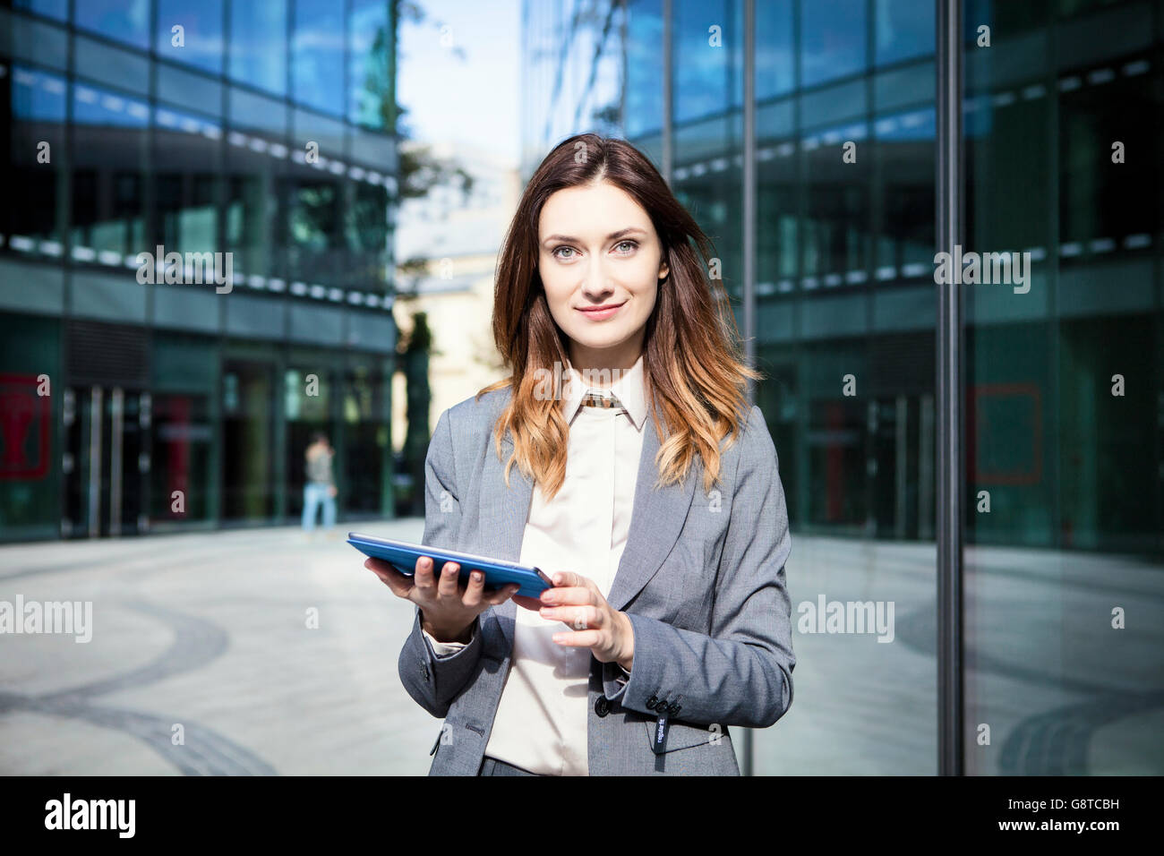 Business woman using digital tablet in city Stock Photo