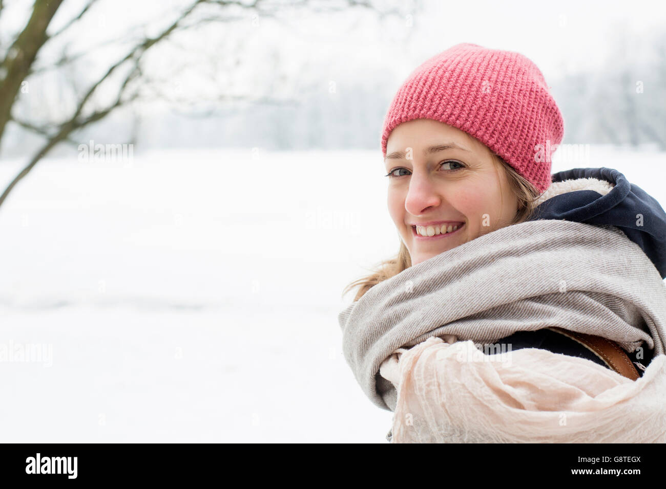 Mid adult woman with knit hat and scarf in winter Stock Photo