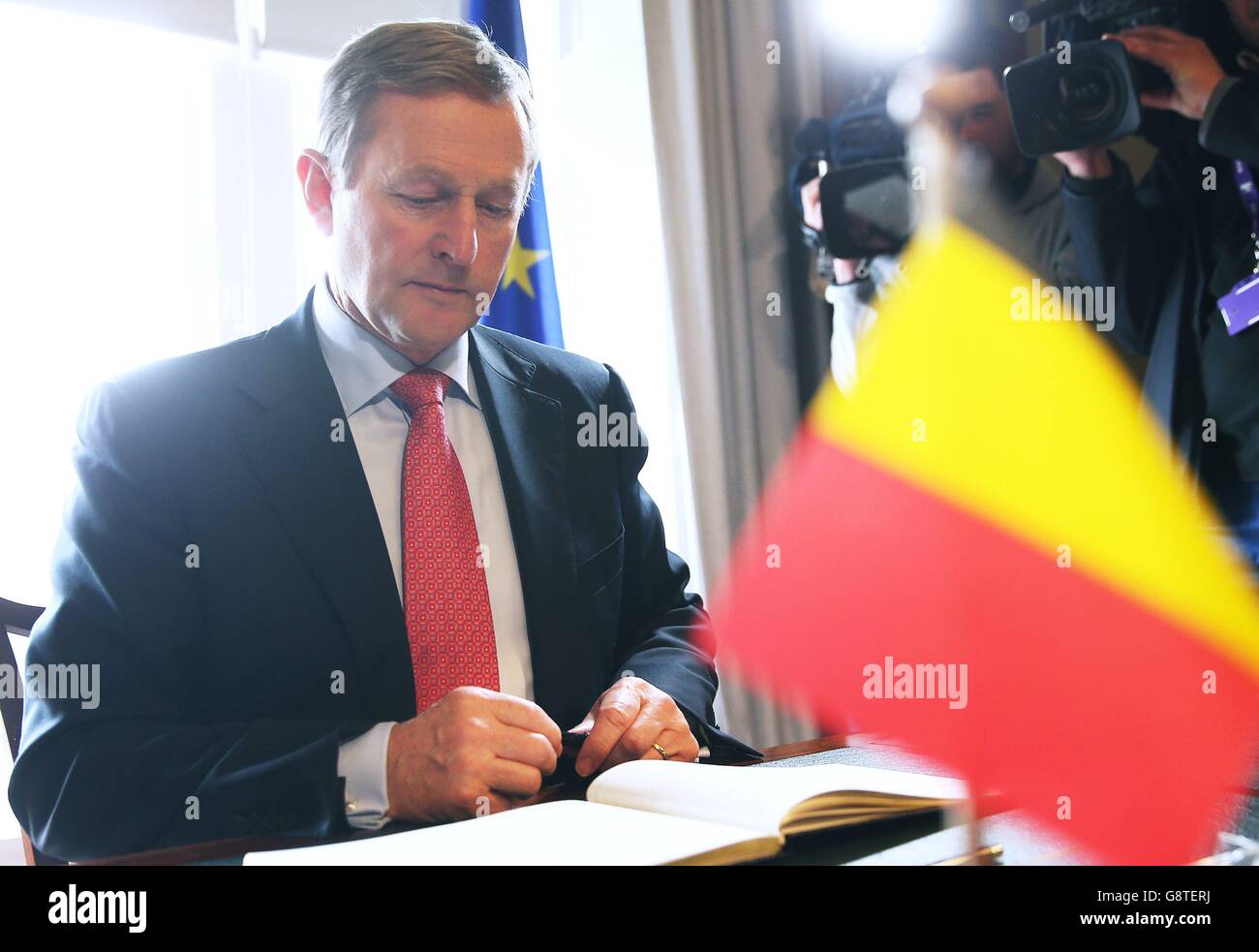 An Taoiseach Enda Kenny signs a book of condolence at the Belgian Embassy in Dublin in the wake of the terror attacks in Brussels. Stock Photo