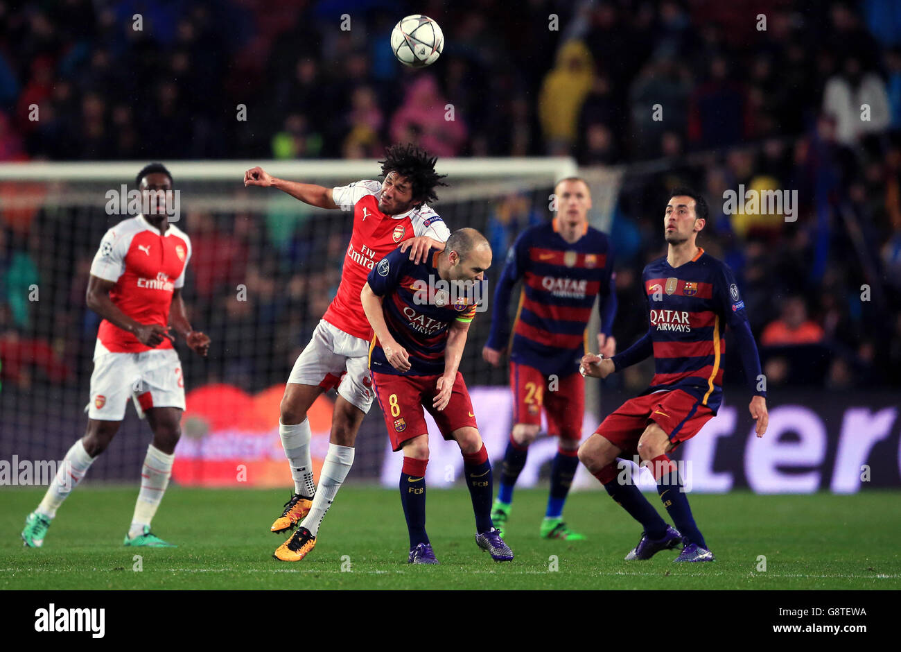 Barcelona v Arsenal - UEFA Champions League - Round of Sixteen - Second Leg - Camp Nou. Arsenal's Mohamed Elneny and Barcelona's Andres Iniesta (right) battle for the ball Stock Photo