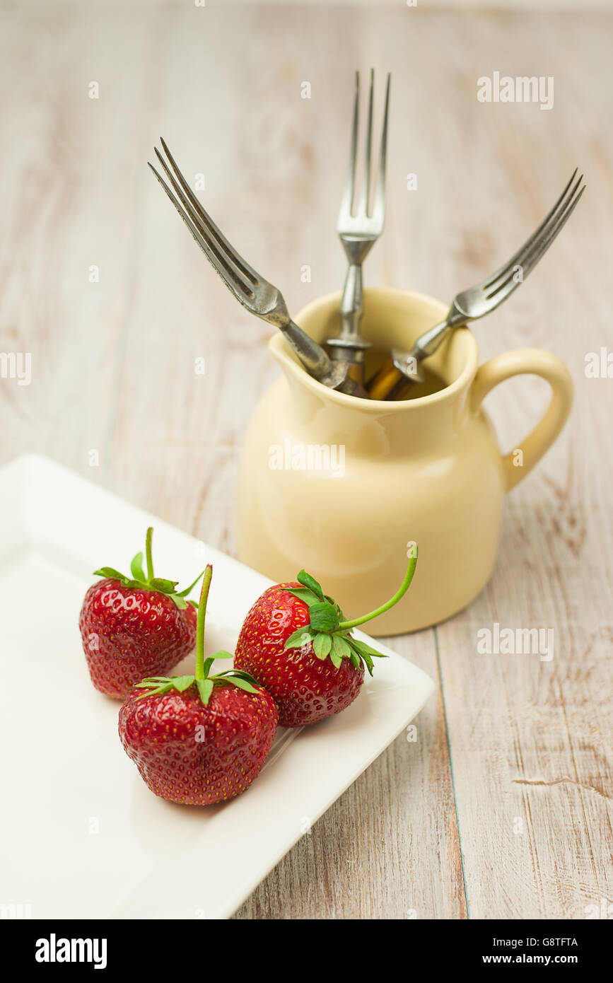 Ripe red strawberries on a white plate Stock Photo - Alamy