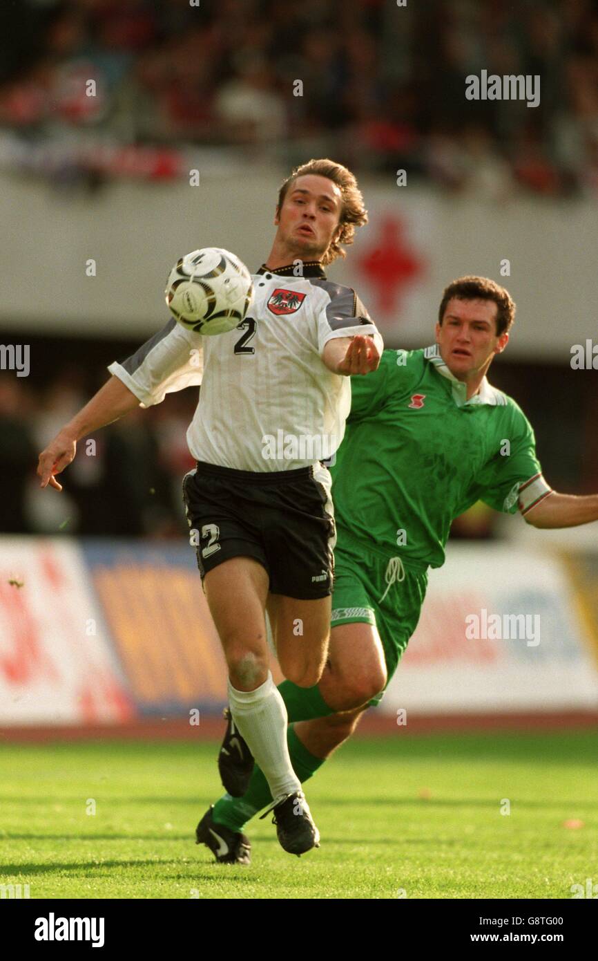 Austria's Harald Cerny (left) shields the ball from Belarus's Sergei Gourenko (right) Stock Photo