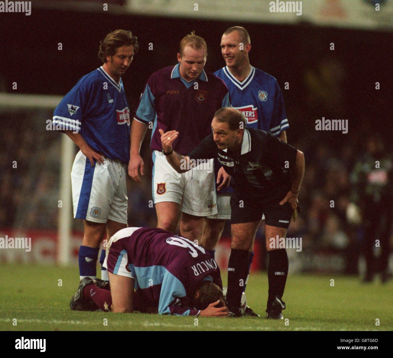Michael Reed Referee West Ham United's John Moncur (on floor) lies injured as referee Mike ...