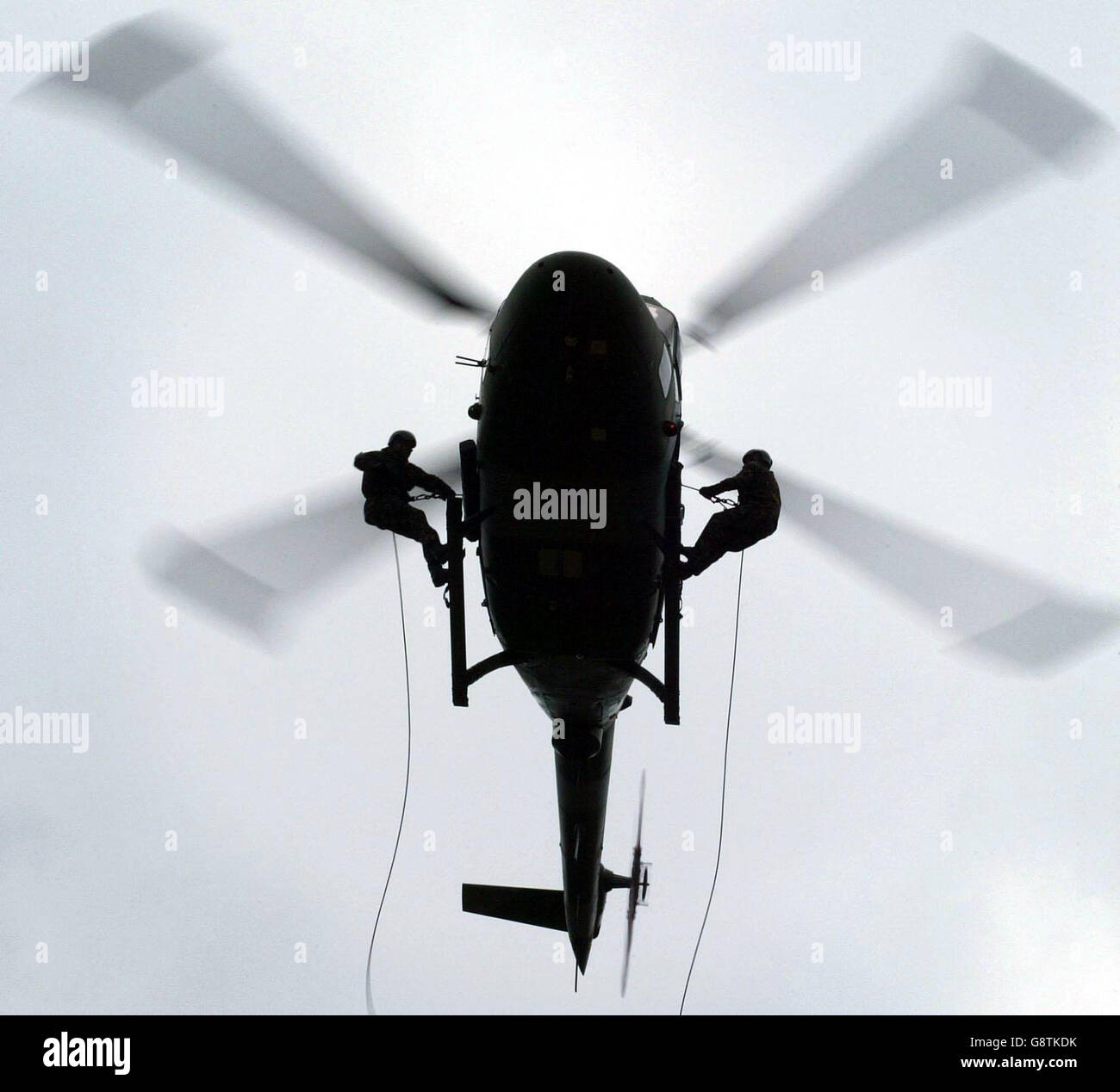 Soldiers from the Royal Electrical and Mechanical Engineers abseil from