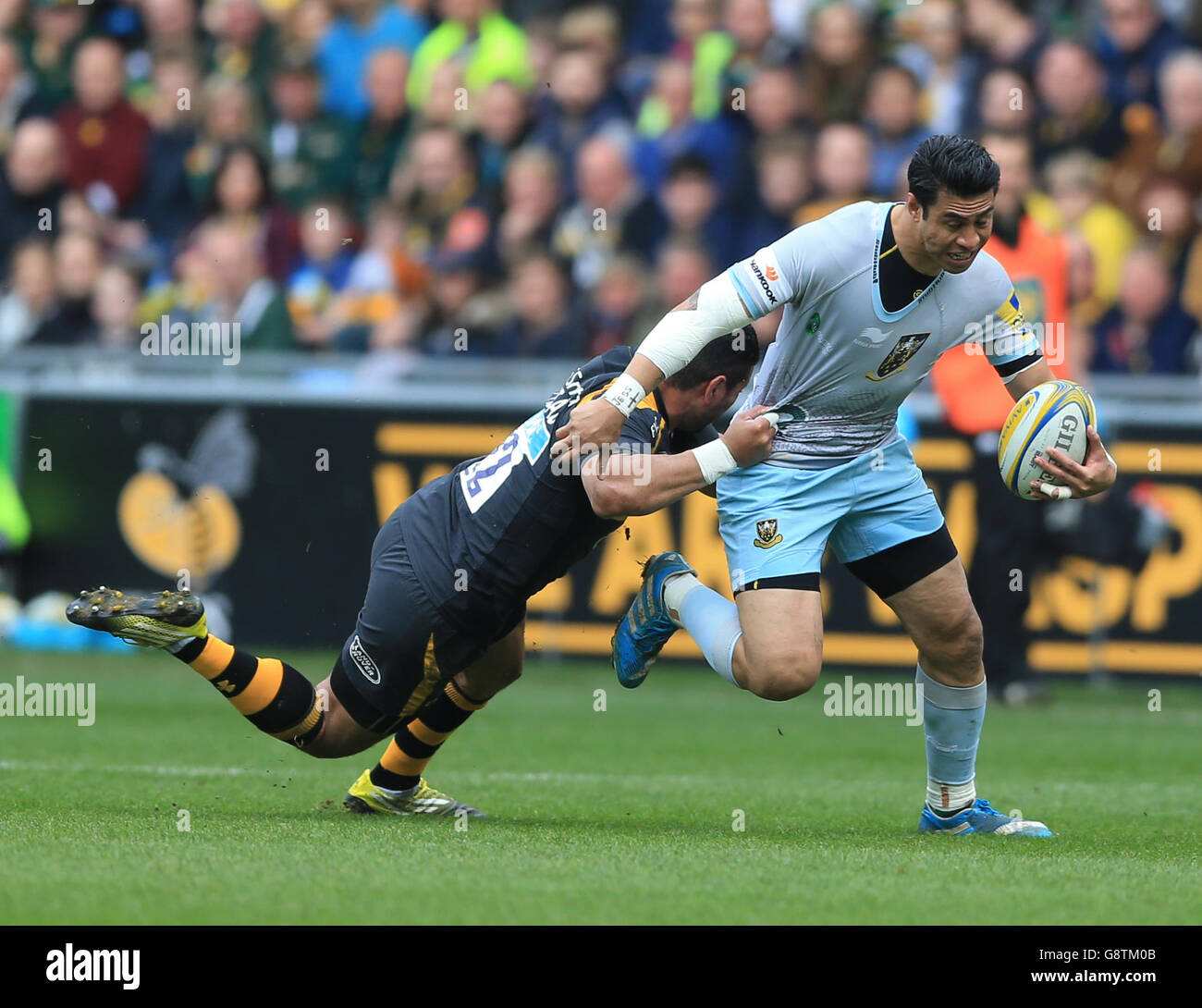 Wasps Siale Piutau (left) tackles Northampton Saints George Pisi during ...