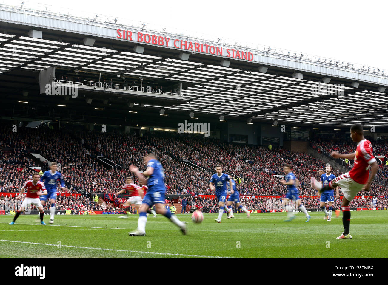 A general view of match action in front of the newly renamed Sir Bobby Charlton Stand during the Barclays Premier League match at Old Trafford, Manchester. Stock Photo