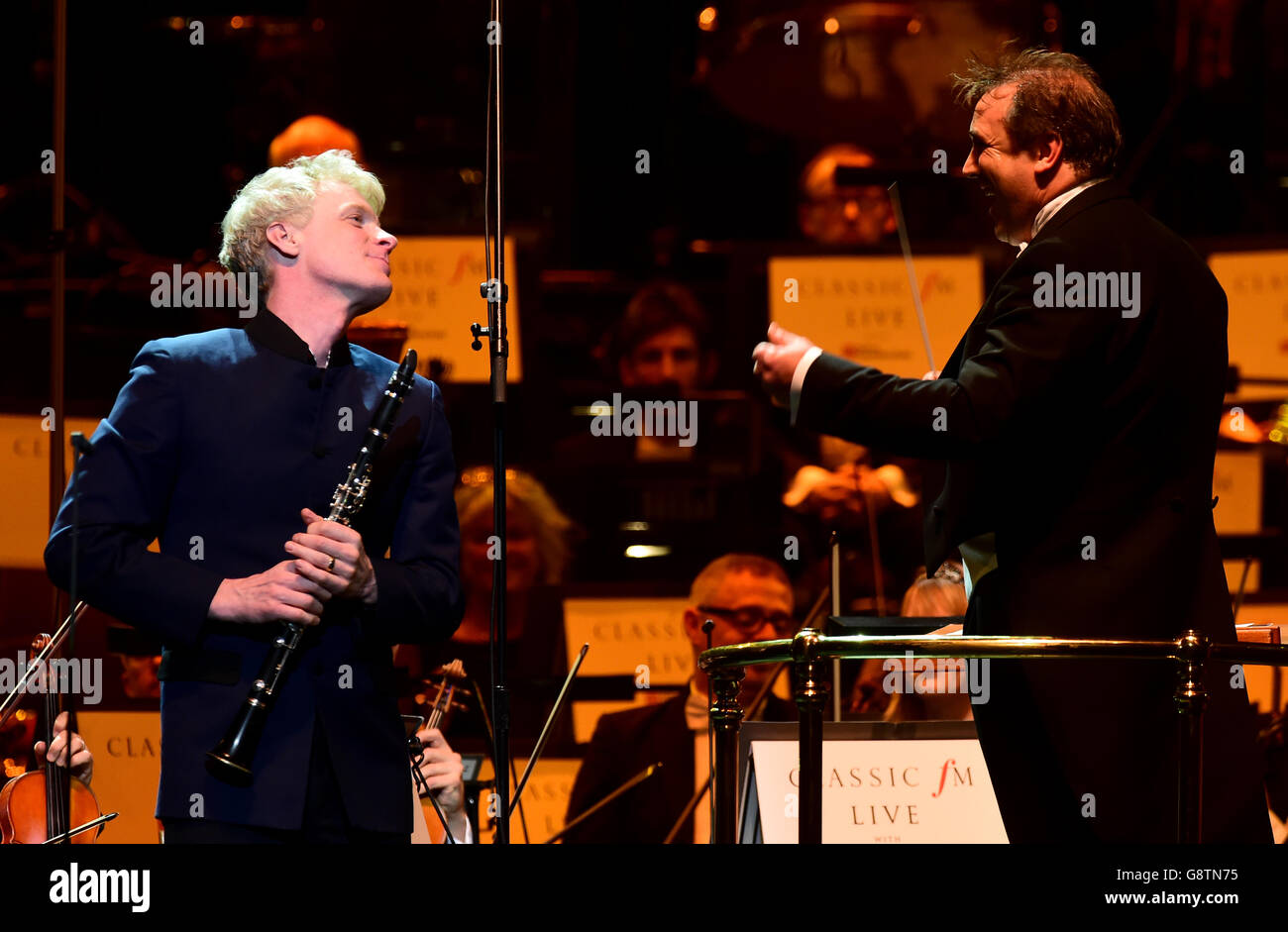 Clarinettist Martin Frost (left) is greeted by conductor Jaime Martin during Classic FM Live at the Royal Albert Hall, London. Stock Photo