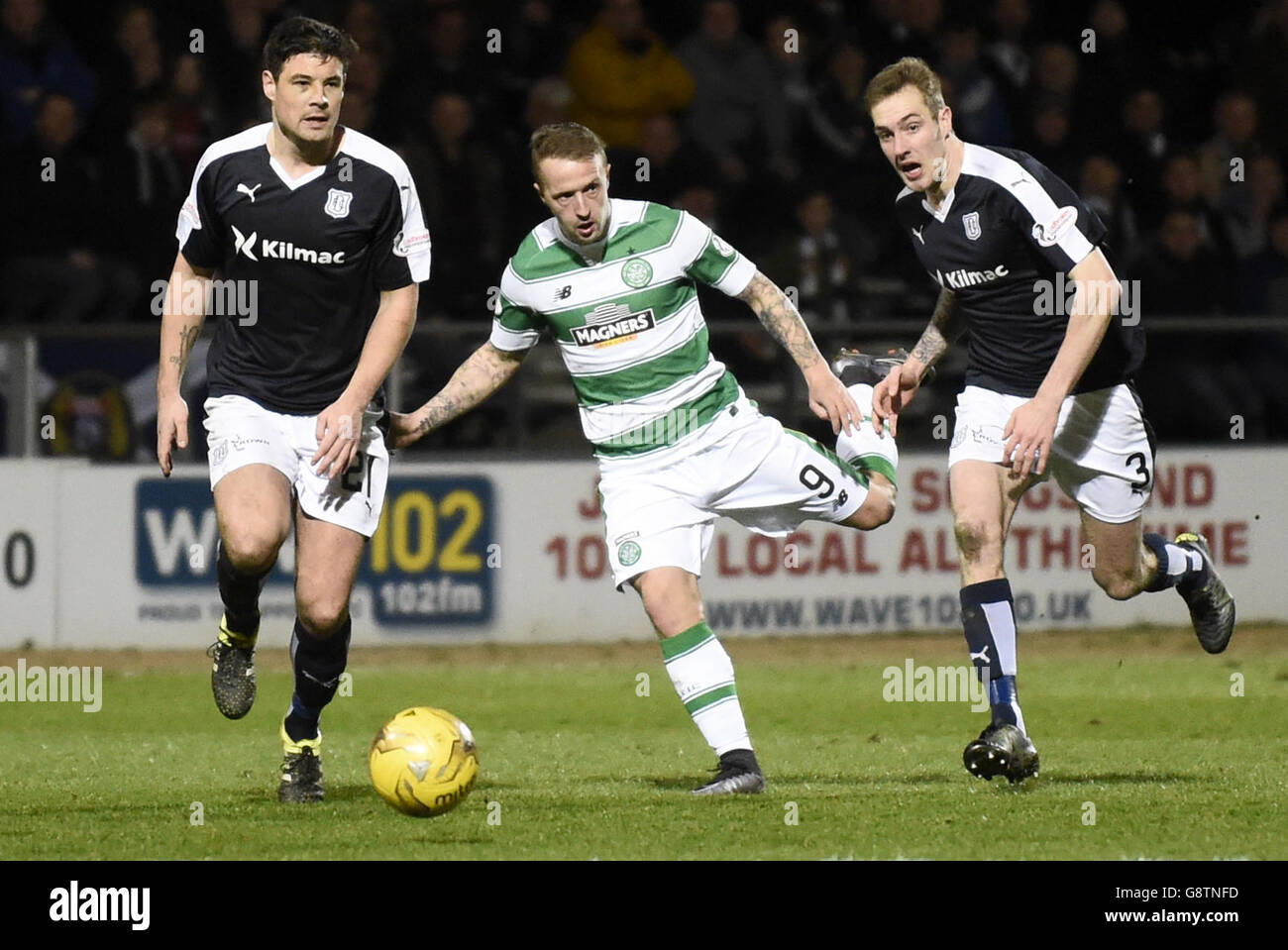 Celtic's Leigh Griffiths battles for the ball with Dundee's Darren O'Dea and Kevin Holt during the Ladbrokes Scottish Premiership match at Dens Park, Dundee. Stock Photo
