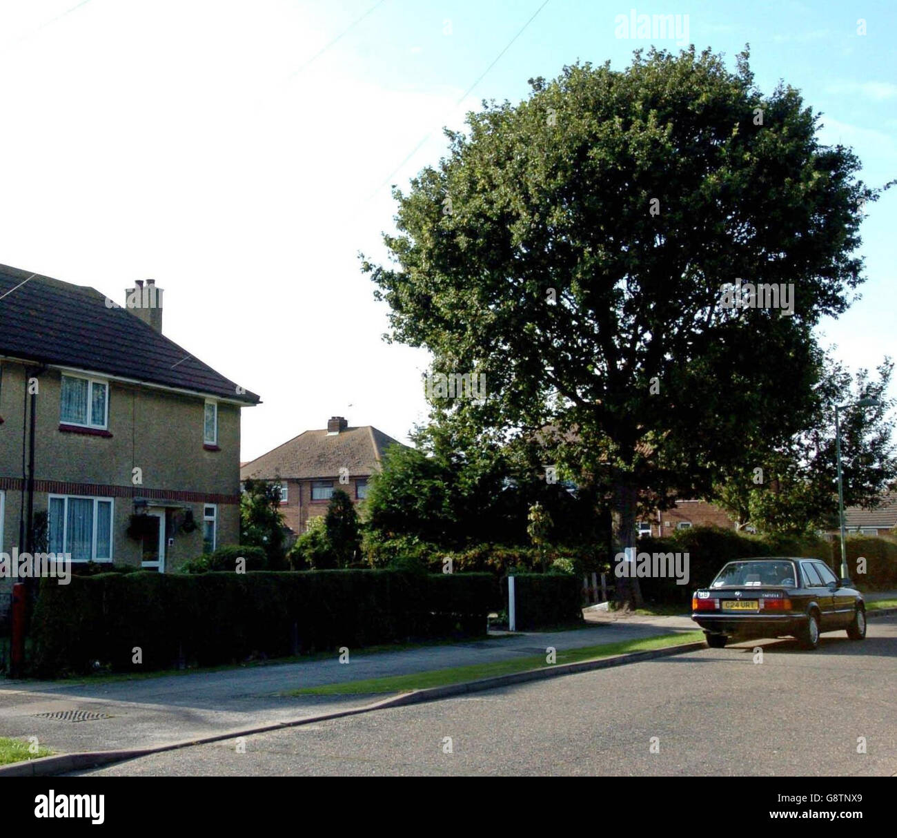 The home (left) of Arthur Burgess, 80, in Trimley St Martin, Ipswich, who was convicted at Ipswich Magistrates Court Wednesday September 21 2005, of assaulting police, harassment and criminal damage. The 80-year-old Second World War veteran who 'got a bee in his bonnet' about an oak tree overhanging his garden has been remanded in custody for three weeks pending sentencing. See PA story COURTS Veteran. PRESS ASSOCIATION Photo. Photo credit should read: Chris Radburn / PA. Stock Photo