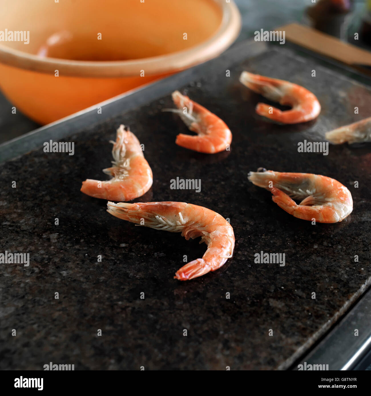 Fresh shrimps cooking on a grill, outdoor closeup shot, shallow depth of field Stock Photo