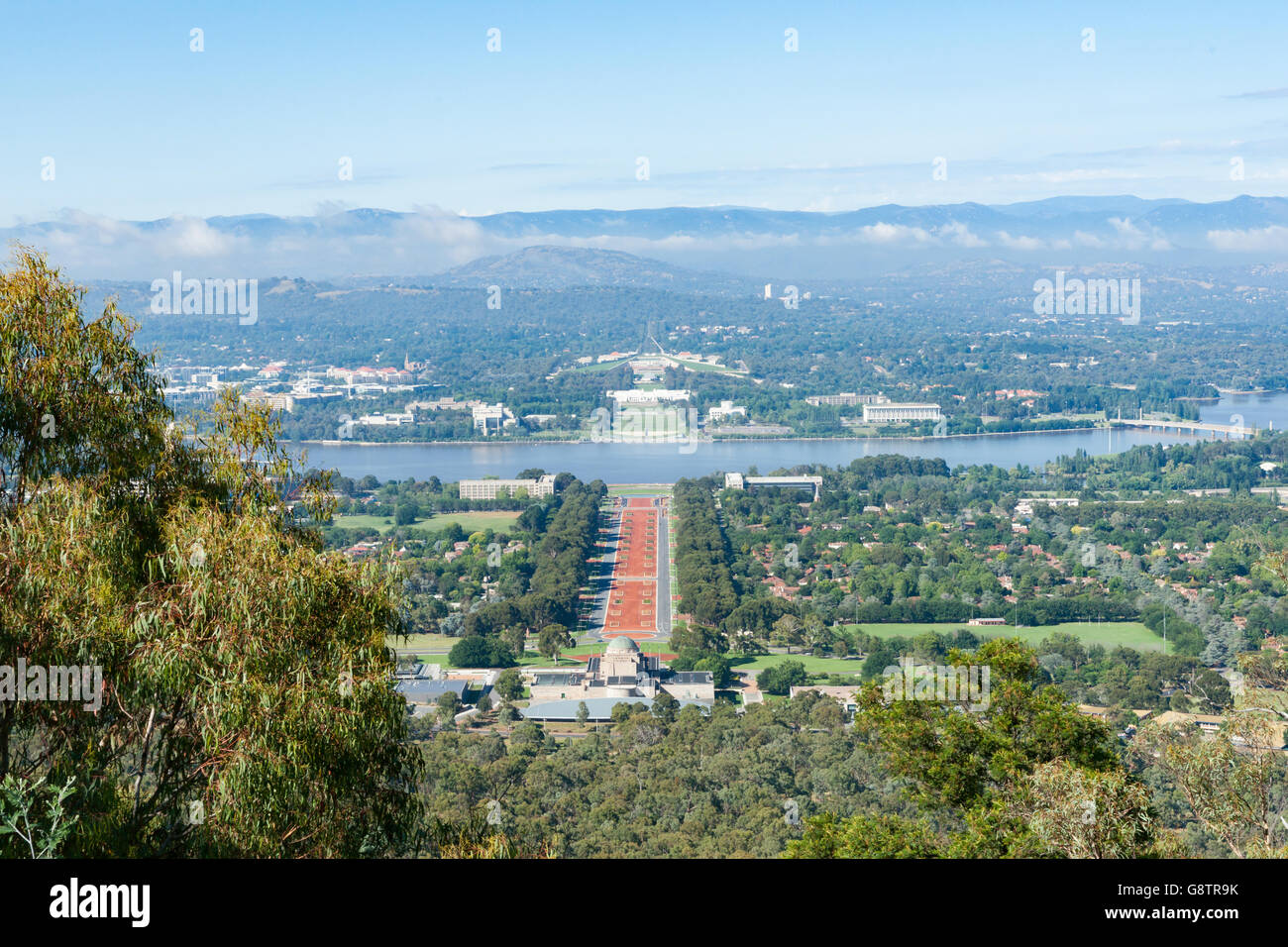 Canberra view from Mount Ainslie over orange colored Anzac Parade below to Houses of Parliament and Molonglo River Stock Photo