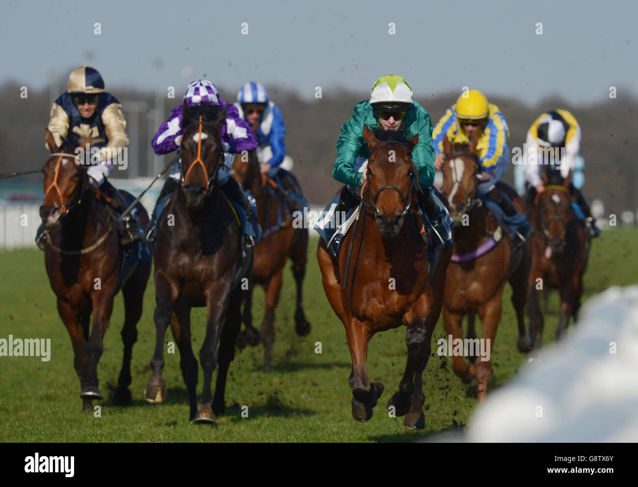 Hereawi ridden by Richard Kingscote (centre, right) wins the Park Hill Private Hospital Maiden Stakes during Betway Lincoln Day at Doncaster Racecourse, Doncaster. Stock Photo