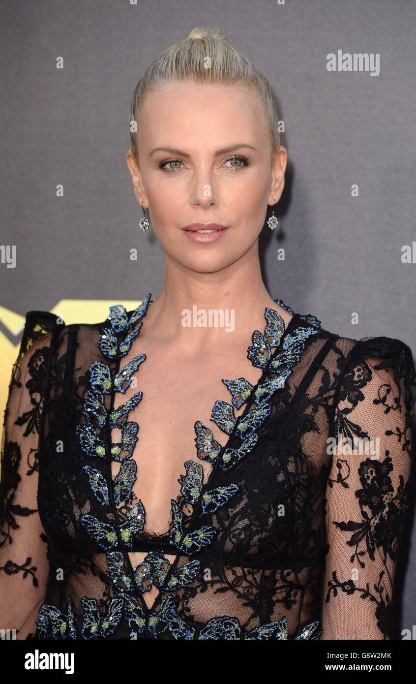 Charlize Theron arriving at the 2016 MTV Movie Awards at Warner Bros Studios in Burbank, Los Angeles. Stock Photo